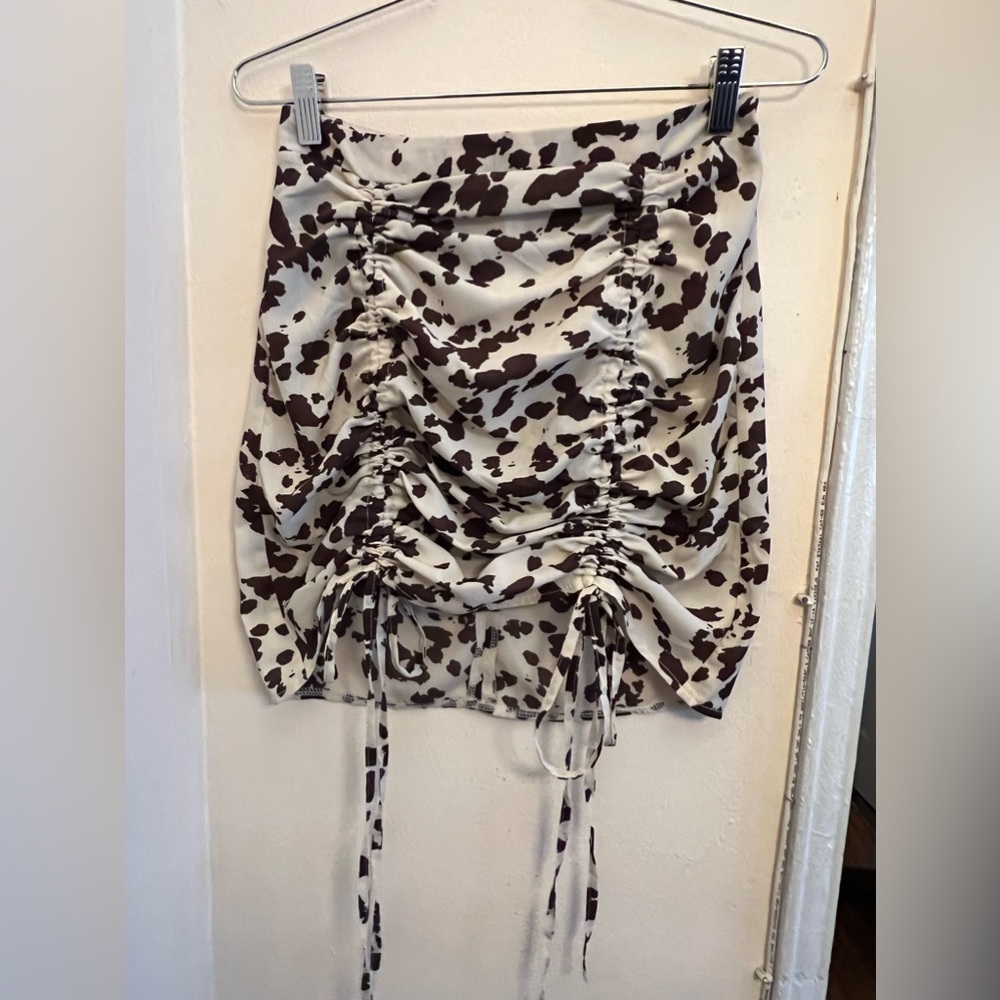 Nasty Gal brown cow print fitted mini skirt with adjustable draw string.